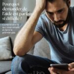 Homme pensif avec son téléphone - Pourquoi demander de l'aide est parfois si difficile